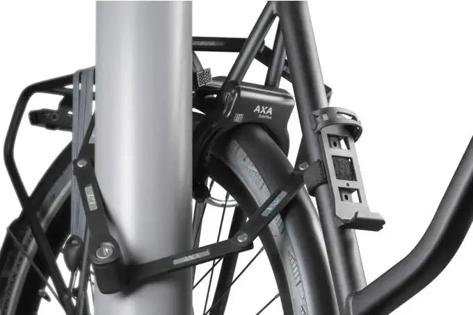 AXA Fold Lite 100 bicycle lock attached to a pole for secure protection.