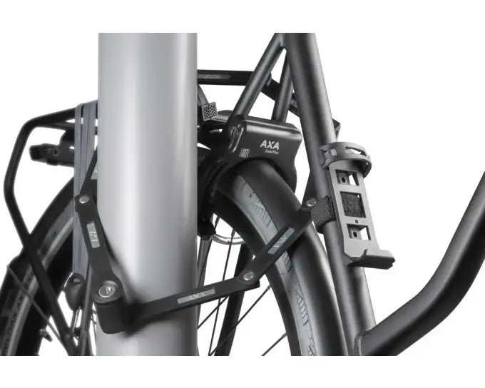 AXA Fold Lite 100 bicycle lock attached to a pole for secure protection.