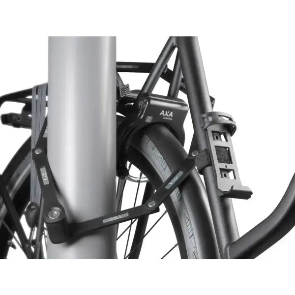 AXA Fold Lite 100 bicycle lock attached to a pole for secure protection.